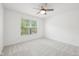 Bedroom featuring a ceiling fan and a large window that provides ample natural light at 764 Bloor Woods Ct, Zionsville, IN 46077