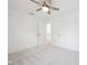 Bright bedroom features plush carpeting, a ceiling fan, and convenient access to the hallway at 764 Bloor Woods Ct, Zionsville, IN 46077