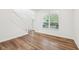 Bright entryway with natural light, hardwood floors, and staircase at 764 Bloor Woods Ct, Zionsville, IN 46077