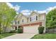 Charming two-story home featuring a brick facade and an attached two-car garage at 764 Bloor Woods Ct, Zionsville, IN 46077