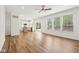 Open floor plan showcasing living room and kitchen with hardwood floors and natural light at 764 Bloor Woods Ct, Zionsville, IN 46077