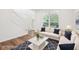 Cozy living room with modern furnishings, hardwood flooring, and ample natural light at 764 Bloor Woods Ct, Zionsville, IN 46077