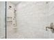 Tiled shower with multiple shower heads, built-in niche, and glass door at 764 Bloor Woods Ct, Zionsville, IN 46077
