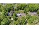 An aerial view of a secluded home surrounded by mature trees and landscaping at 8100 N Meridian St, Indianapolis, IN 46260