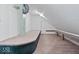Finished attic space with neutral carpeting and trim, and access door at 8100 N Meridian St, Indianapolis, IN 46260
