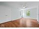 Bright bedroom features hardwood floors, fresh paint, and a ceiling fan at 8100 N Meridian St, Indianapolis, IN 46260