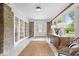 Inviting entryway with stone walls, tile flooring, and view of the decorative front door at 8100 N Meridian St, Indianapolis, IN 46260
