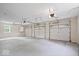Spacious three car garage featuring high ceilings and ample lighting at 8100 N Meridian St, Indianapolis, IN 46260