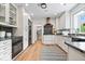 Modern kitchen featuring white cabinets, black appliances and granite countertops at 8100 N Meridian St, Indianapolis, IN 46260