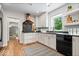 Bright kitchen featuring granite countertops, white cabinetry and stainless steel appliances at 8100 N Meridian St, Indianapolis, IN 46260