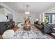 Open living room with hardwood floors, modern furnishings, and plenty of natural light at 8100 N Meridian St, Indianapolis, IN 46260
