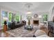 Cozy living room with hardwood floors, neutral decor, and a decorative fireplace at 8100 N Meridian St, Indianapolis, IN 46260