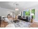 Bright living room with a large window, hardwood floors, and modern decor at 8100 N Meridian St, Indianapolis, IN 46260