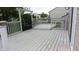 Back deck with a hanging swing, painted white with railings, and providing an outdoor living space at 8160 Whitham Dr, Indianapolis, IN 46237