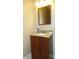 Bathroom vanity with granite countertop and framed mirror adds touch of class at 8160 Whitham Dr, Indianapolis, IN 46237