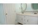 Bathroom featuring double sinks, white cabinetry, and modern fixtures at 8160 Whitham Dr, Indianapolis, IN 46237