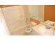 Bathroom showcasing the tub and shower, as well as a sink with updated fixtures and a mirror at 8160 Whitham Dr, Indianapolis, IN 46237