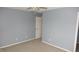 Spacious bedroom featuring ceiling fan, carpeted floors, and a light blue wall paint at 8160 Whitham Dr, Indianapolis, IN 46237