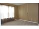 Bright bedroom featuring neutral carpet, a window letting in natural light, and neutral walls at 8160 Whitham Dr, Indianapolis, IN 46237