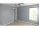 Bedroom featuring a ceiling fan, carpeted floors, light blue walls, and ample sunlight at 8160 Whitham Dr, Indianapolis, IN 46237
