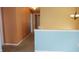 Bright hallway with neutral carpet, blue accents and decorative light fixture at 8160 Whitham Dr, Indianapolis, IN 46237