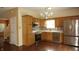Eat-in kitchen featuring stainless steel appliances, natural wood cabinets and hardwood floors at 8160 Whitham Dr, Indianapolis, IN 46237