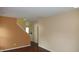 Spacious living room with hardwood floors, large windows, and light-filled open floor plan at 8160 Whitham Dr, Indianapolis, IN 46237