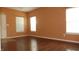 Bright living room with hardwood floors, white trim and neutral paint at 8160 Whitham Dr, Indianapolis, IN 46237