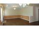 A large open concept living room with decorative trim work and ample space for entertaining guests at 8160 Whitham Dr, Indianapolis, IN 46237