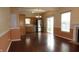 Open-concept living room boasts a fireplace, dining area and sliding glass doors to the back at 8160 Whitham Dr, Indianapolis, IN 46237