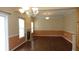 A spacious living room features a decorative fireplace, chandelier and plenty of natural light at 8160 Whitham Dr, Indianapolis, IN 46237