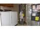 Utility room features a washer, dryer, hot water tank and furnace at 8160 Whitham Dr, Indianapolis, IN 46237