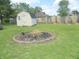 Spacious backyard with fire pit and shed, great for outdoor activities at 833 N 700 W, Greenfield, IN 46140