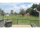 Backyard with an expansive lawn, red barn, and a view from the deck at 833 N 700 W, Greenfield, IN 46140