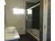 Modern bathroom featuring a sleek vanity, vessel sink and a glass-enclosed shower/tub at 833 N 700 W, Greenfield, IN 46140