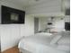 Bedroom featuring a large television, ample closet space, and a comfortable bed at 833 N 700 W, Greenfield, IN 46140