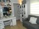 Well-organized closet with makeup vanity, custom shelving, and comfortable seating area at 833 N 700 W, Greenfield, IN 46140