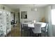 Bright dining room featuring stylish lighting, a round table, and views into adjacent rooms at 833 N 700 W, Greenfield, IN 46140