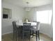 Elegant dining area with a round table, comfortable seating, and natural light at 833 N 700 W, Greenfield, IN 46140