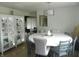 Stylish dining room with a modern chandelier, white table, and seating for six at 833 N 700 W, Greenfield, IN 46140
