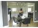 Dining room with modern table set in open floor plan with kitchen featuring stainless steel appliances at 833 N 700 W, Greenfield, IN 46140