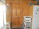 Utility door inside a garage, equipped with storage shelves at 833 N 700 W, Greenfield, IN 46140