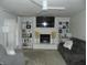 Inviting living room with a cozy fireplace, custom bookcases, and neutral decor at 833 N 700 W, Greenfield, IN 46140
