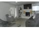 Bright and open living room featuring a fireplace, built-in shelving, and comfortable seating at 833 N 700 W, Greenfield, IN 46140