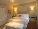 Stylishly decorated main bedroom featuring a comfortable bed and elegant lighting at 833 N 700 W, Greenfield, IN 46140