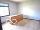 Bright bedroom featuring a large window and a classic wooden dresser at 8835 Winding Ridge Rd, Indianapolis, IN 46217