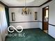 Elegant dining room with a classic chandelier and wainscoting at 8835 Winding Ridge Rd, Indianapolis, IN 46217