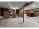 Large finished basement with stairs, office, and storage areas at 8909 Ellington Dr, Indianapolis, IN 46234