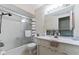 Functional bathroom with a shower-tub combination, vanity, and classic fixtures, offering a clean and bright space at 8909 Ellington Dr, Indianapolis, IN 46234