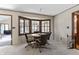 Cozy breakfast nook boasts a charming bay window, carpet, and comfortable seating for casual dining at 8909 Ellington Dr, Indianapolis, IN 46234
